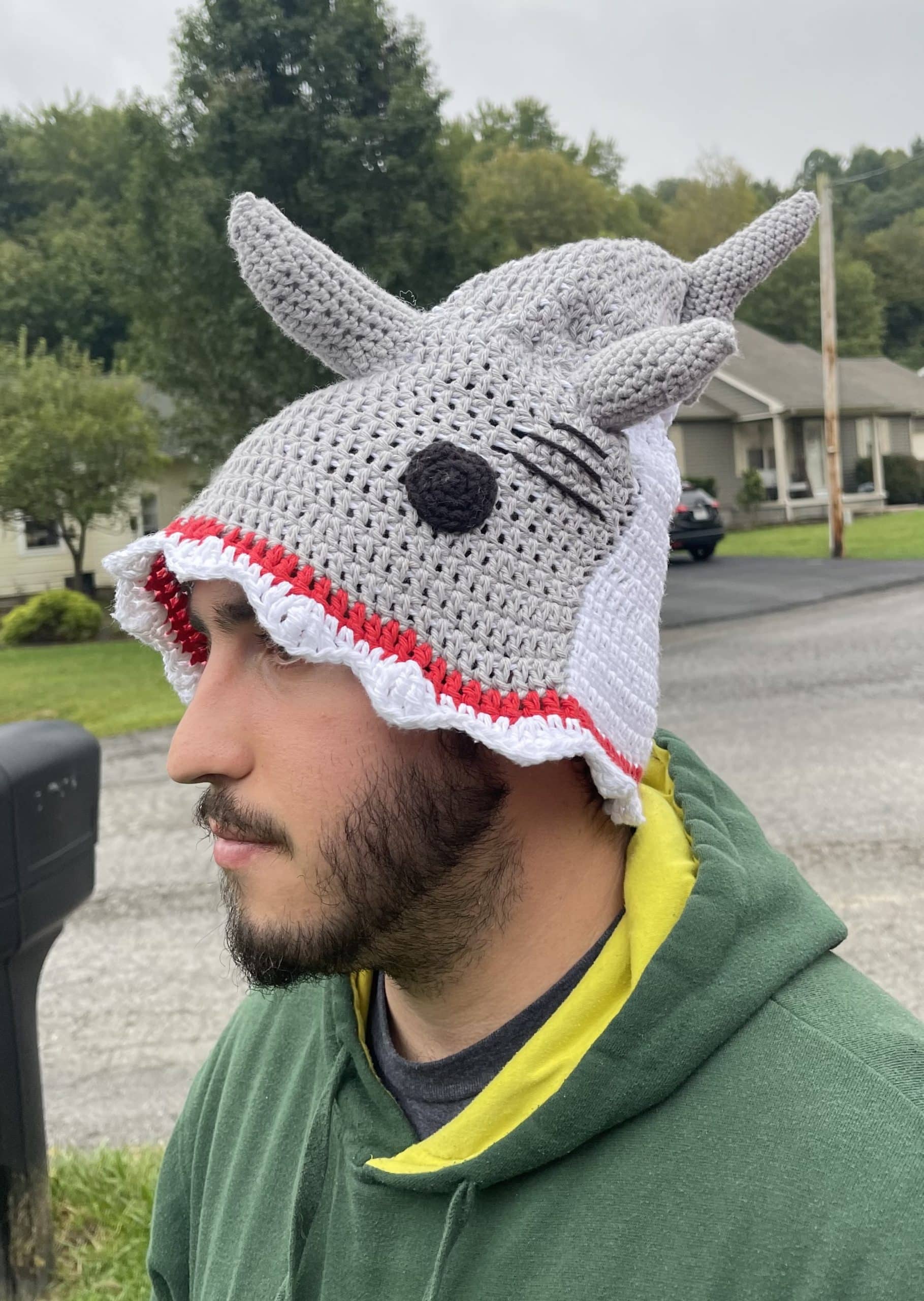 shark hat on head side view with tail stuffing